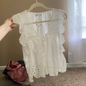 Flowy cut out blouse with button closure